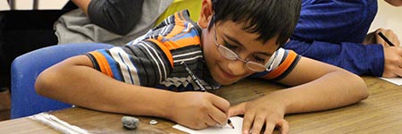 Student sketching in art class.