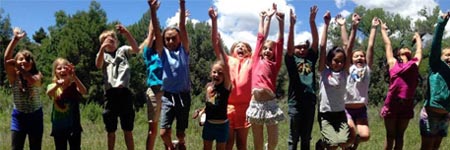 Kids jumping up and down.