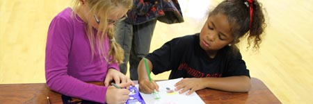Photo of kids working together at Kids' Camp.